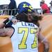 Michigan offensive linesman Taylor Lewan gets a hug and kiss from his mom Kelly Riley, of Arizona, as he walks off the field after Michigan lost 33-28 to South Carolina in the Outback Bowl at Raymond James Stadium in Tampa, Fla. on Tuesday, Jan. 1. Melanie Maxwell I AnnArbor.com